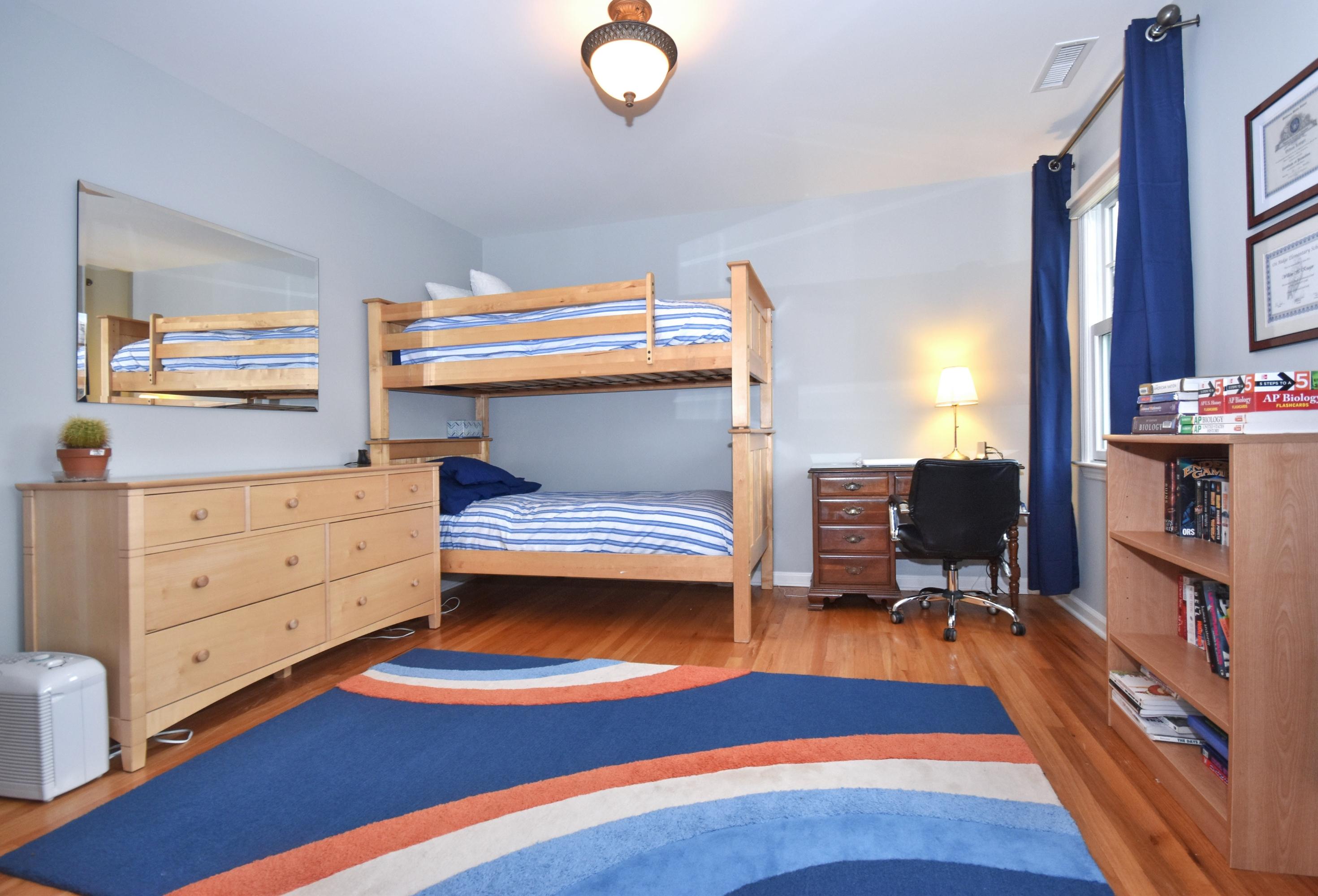 10 Barringer Road Darien, CT 06820 - Photo 17 of 27 a bedroom with a bunk bed and a desk