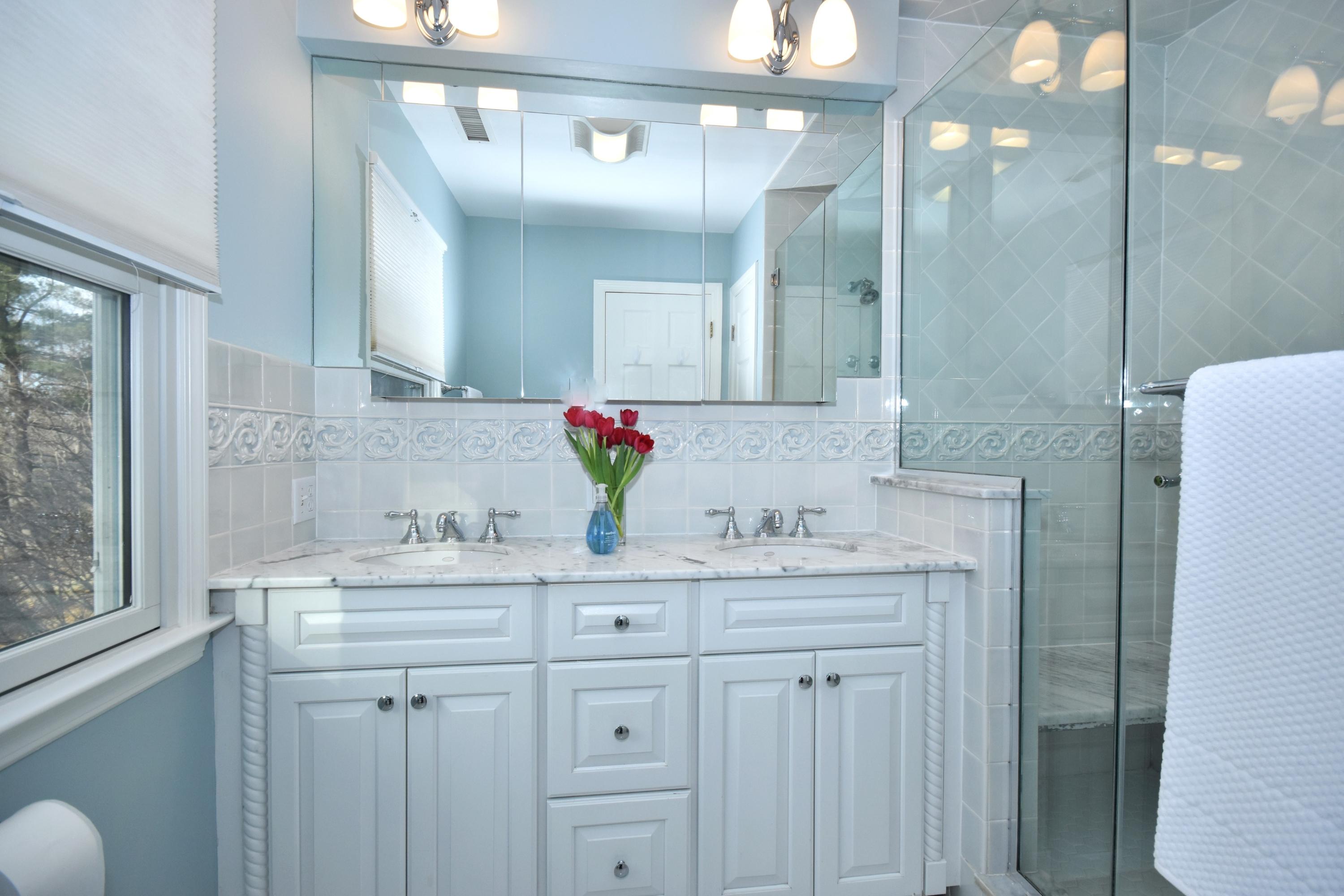 10 Barringer Road Darien, CT 06820 - Photo 18 of 27 a bathroom with a sink and a mirror