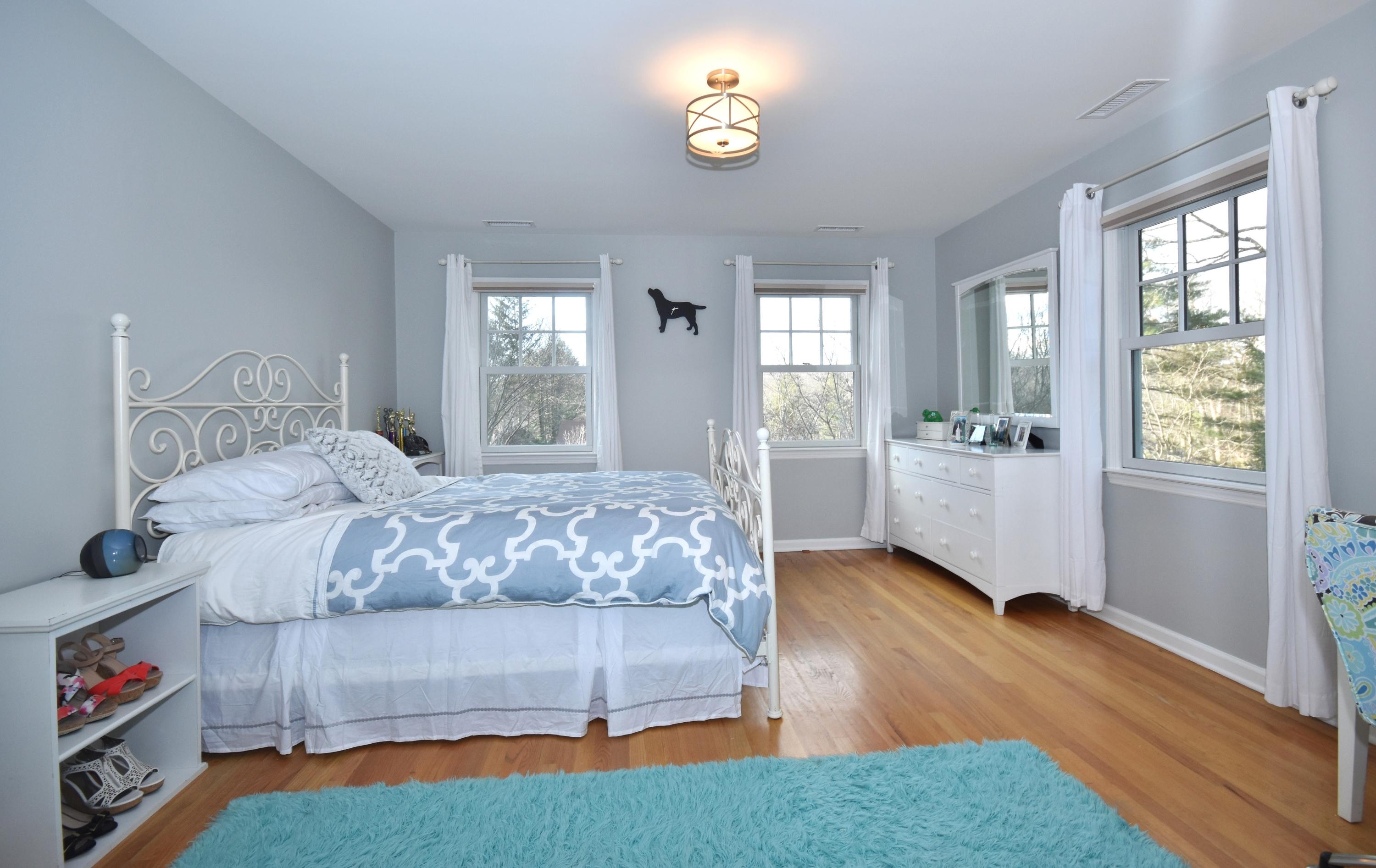 10 Barringer Road Darien, CT 06820 - Photo 19 of 27 a bedroom with a bed and a window