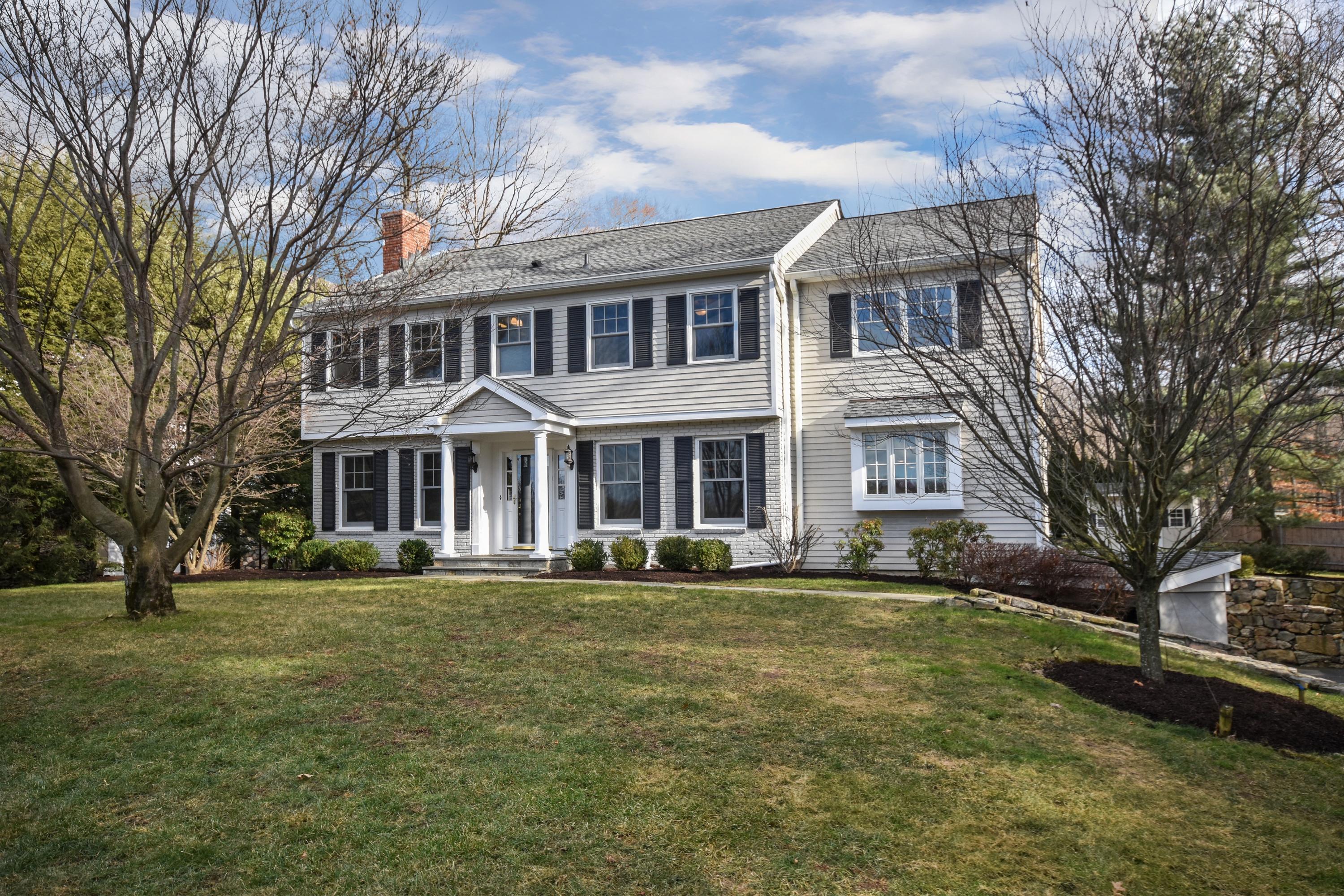 10 Barringer Road Darien, CT 06820 - Photo 2 of 27 a front view of a building with a garden