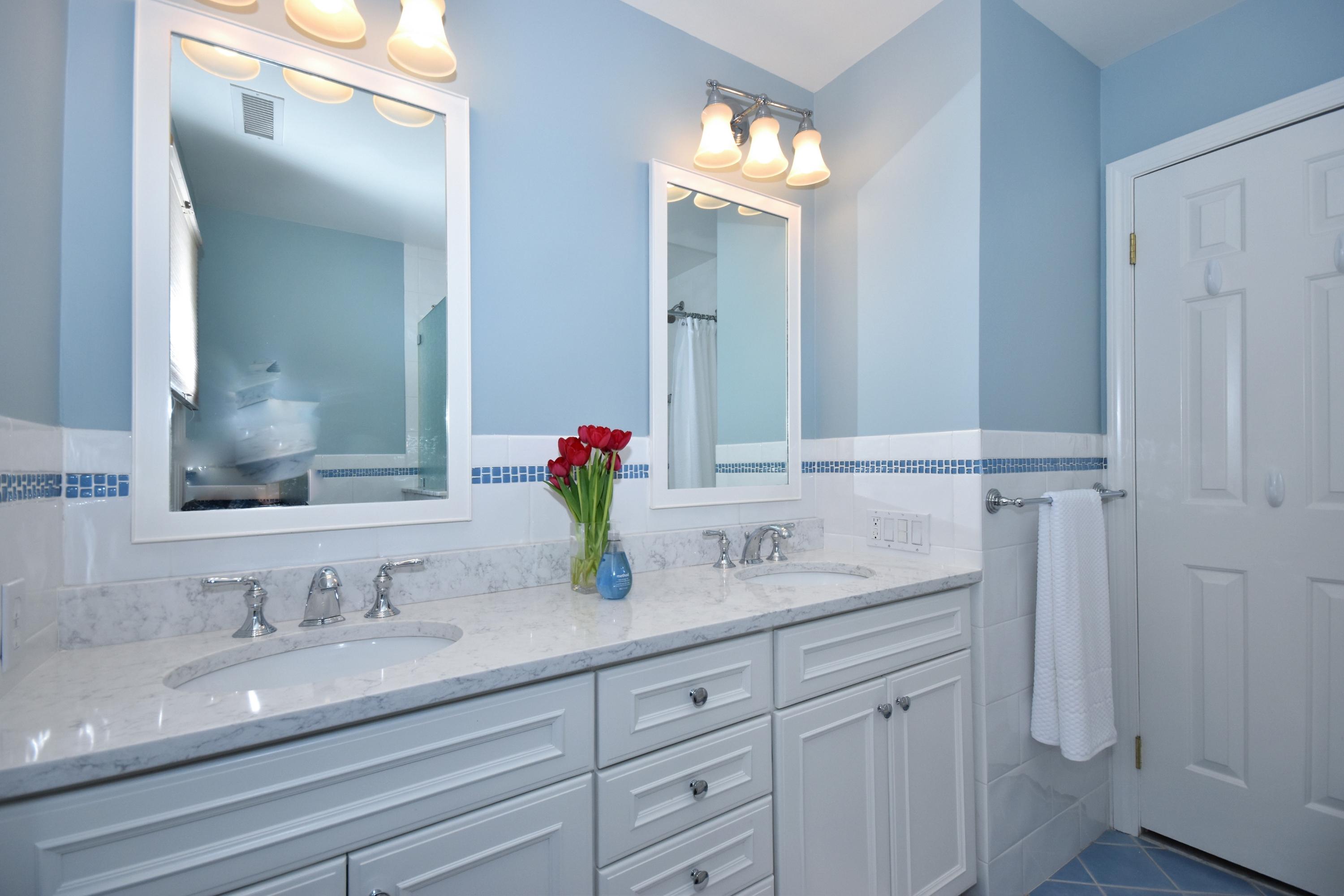10 Barringer Road Darien, CT 06820 - Photo 21 of 27 a bathroom with double sink and a mirror
