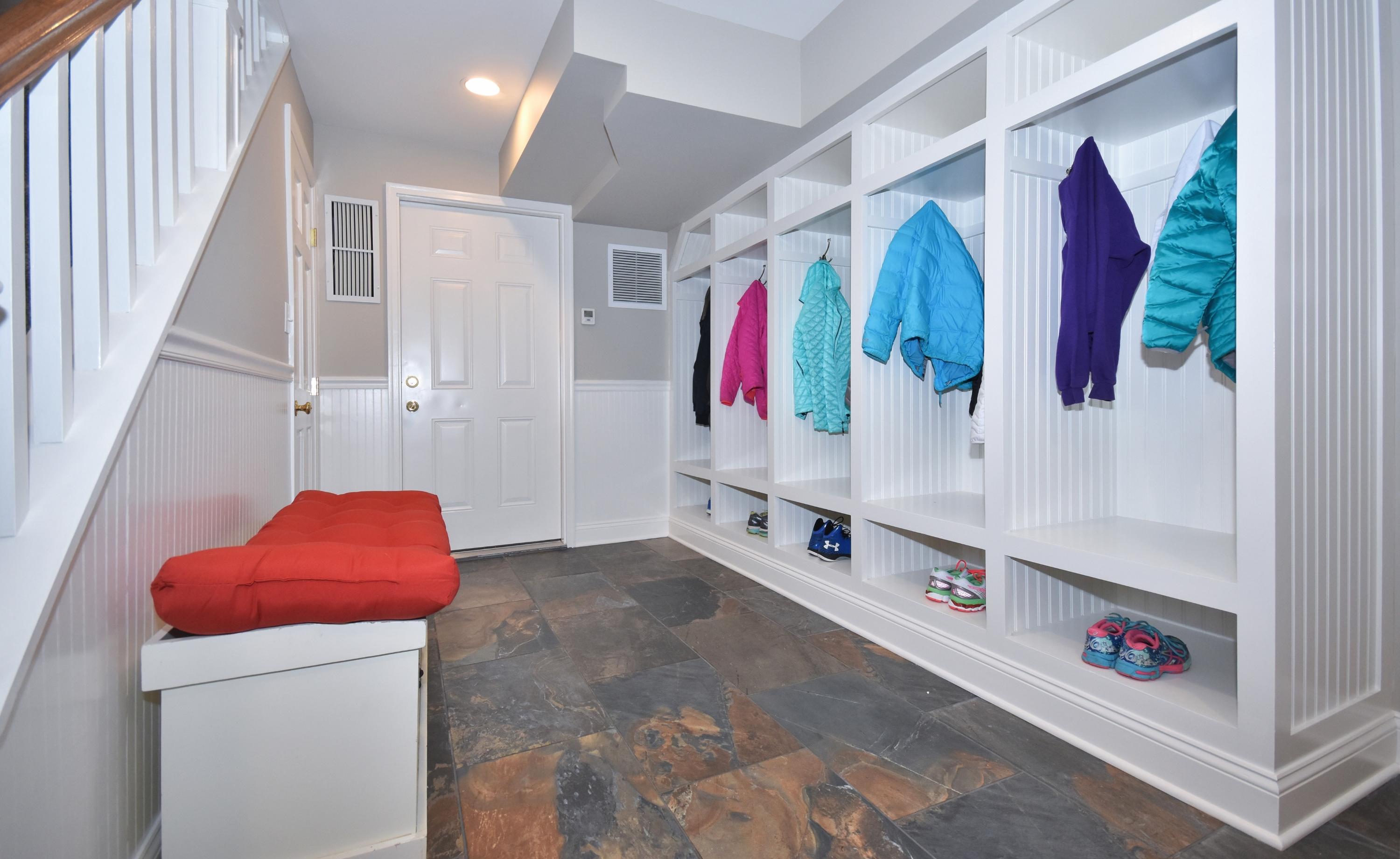10 Barringer Road Darien, CT 06820 - Photo 23 of 27 a view of walk in closet with clothes and shoes