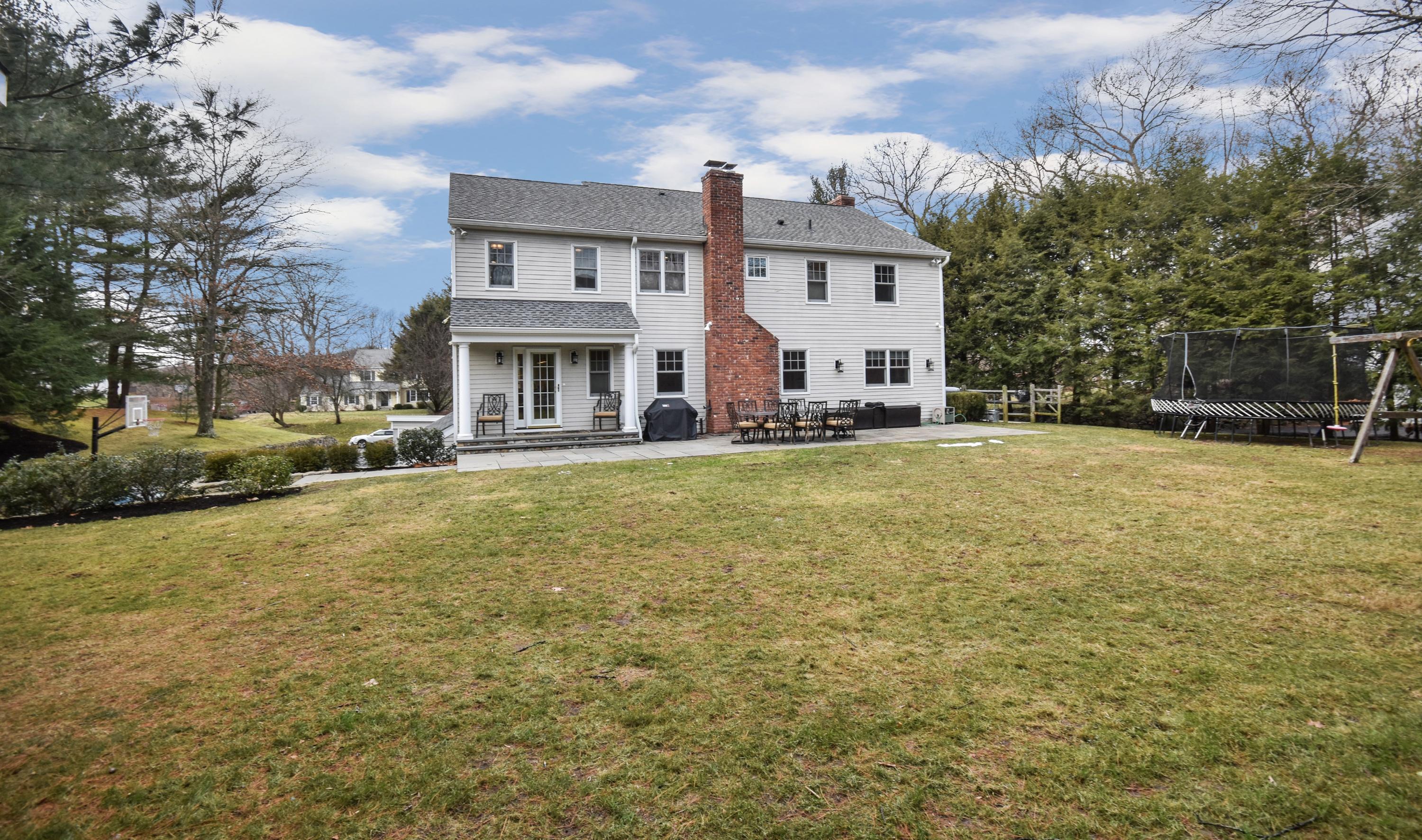 10 Barringer Road Darien, CT 06820 - Photo 26 of 27 a view of house with yard and car parked