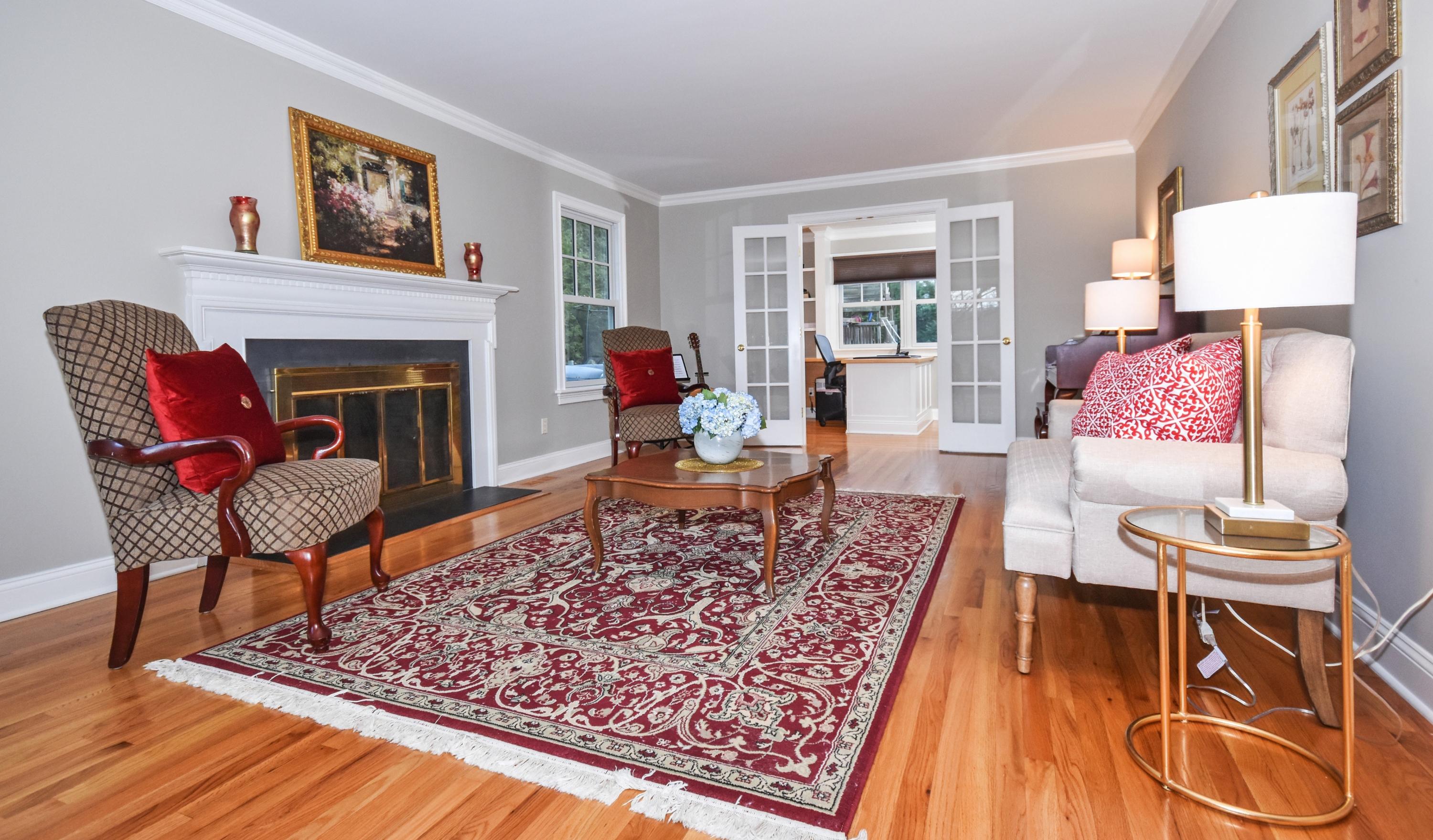 10 Barringer Road Darien, CT 06820 - Photo 4 of 27 a living room with furniture and a fireplace