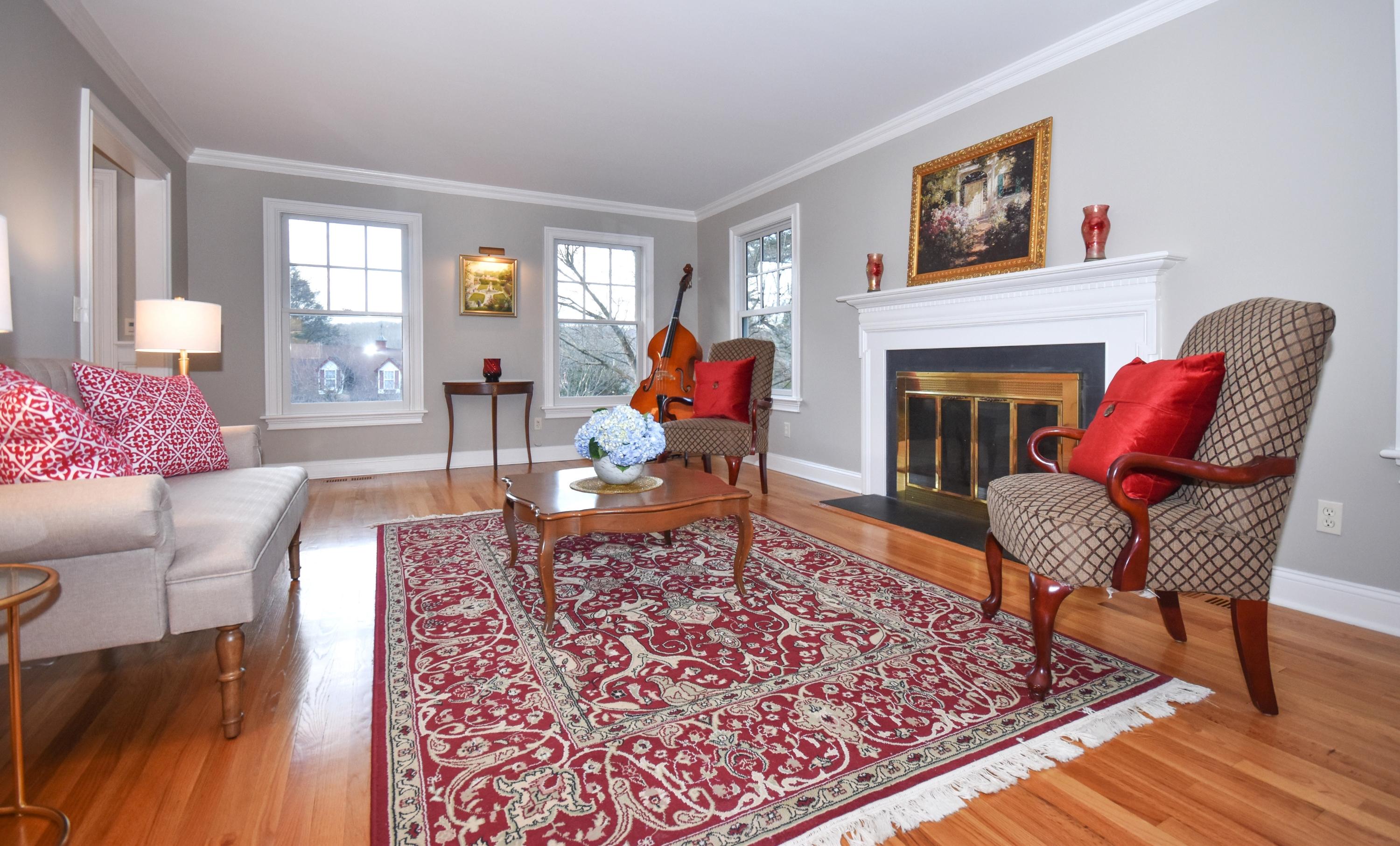 10 Barringer Road Darien, CT 06820 - Photo 5 of 27 a living room with furniture and a fireplace