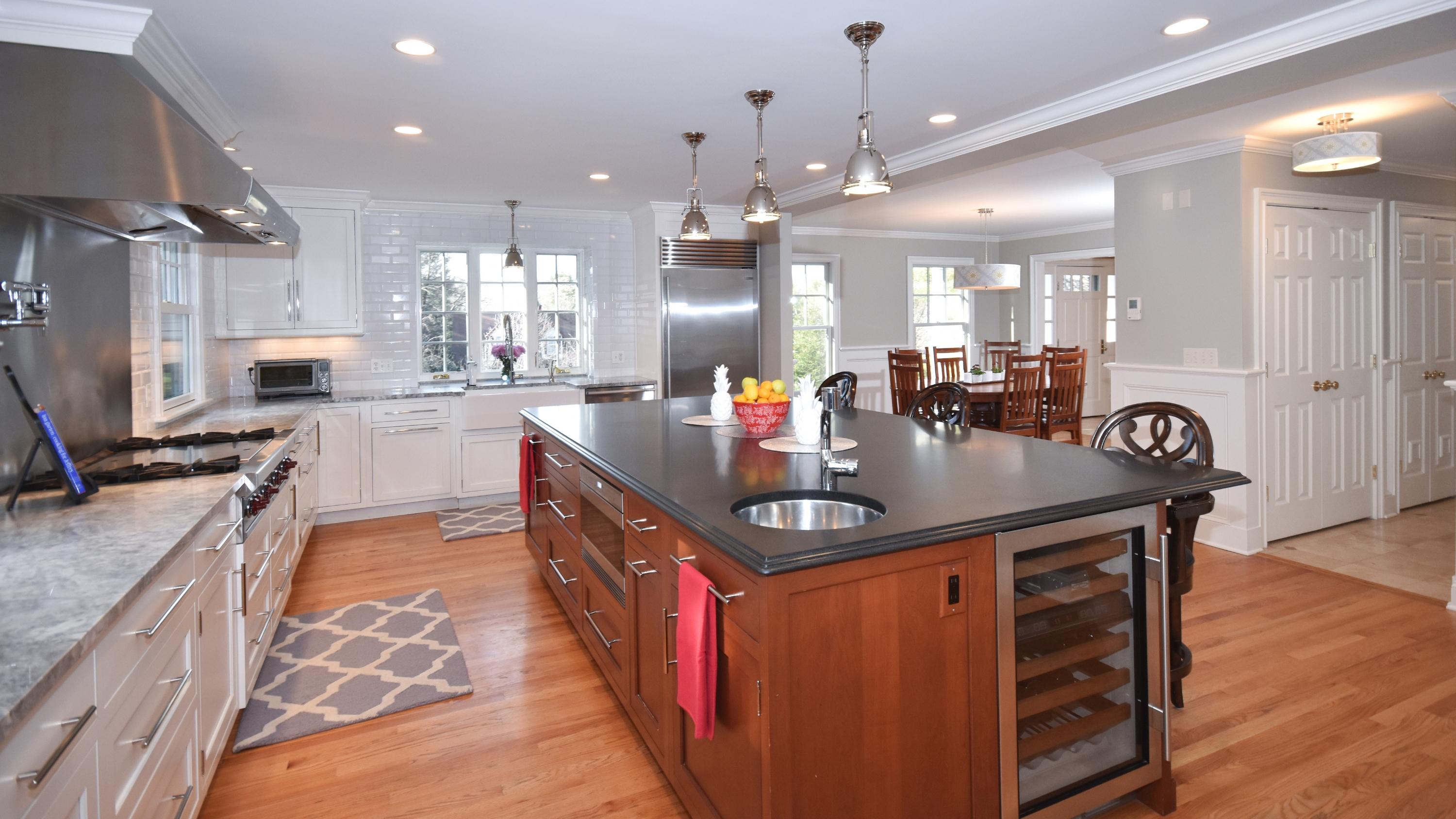 10 Barringer Road Darien, CT 06820 - Photo 8 of 27 a kitchen with stainless steel appliances granite countertop a sink a stove and a wooden floors
