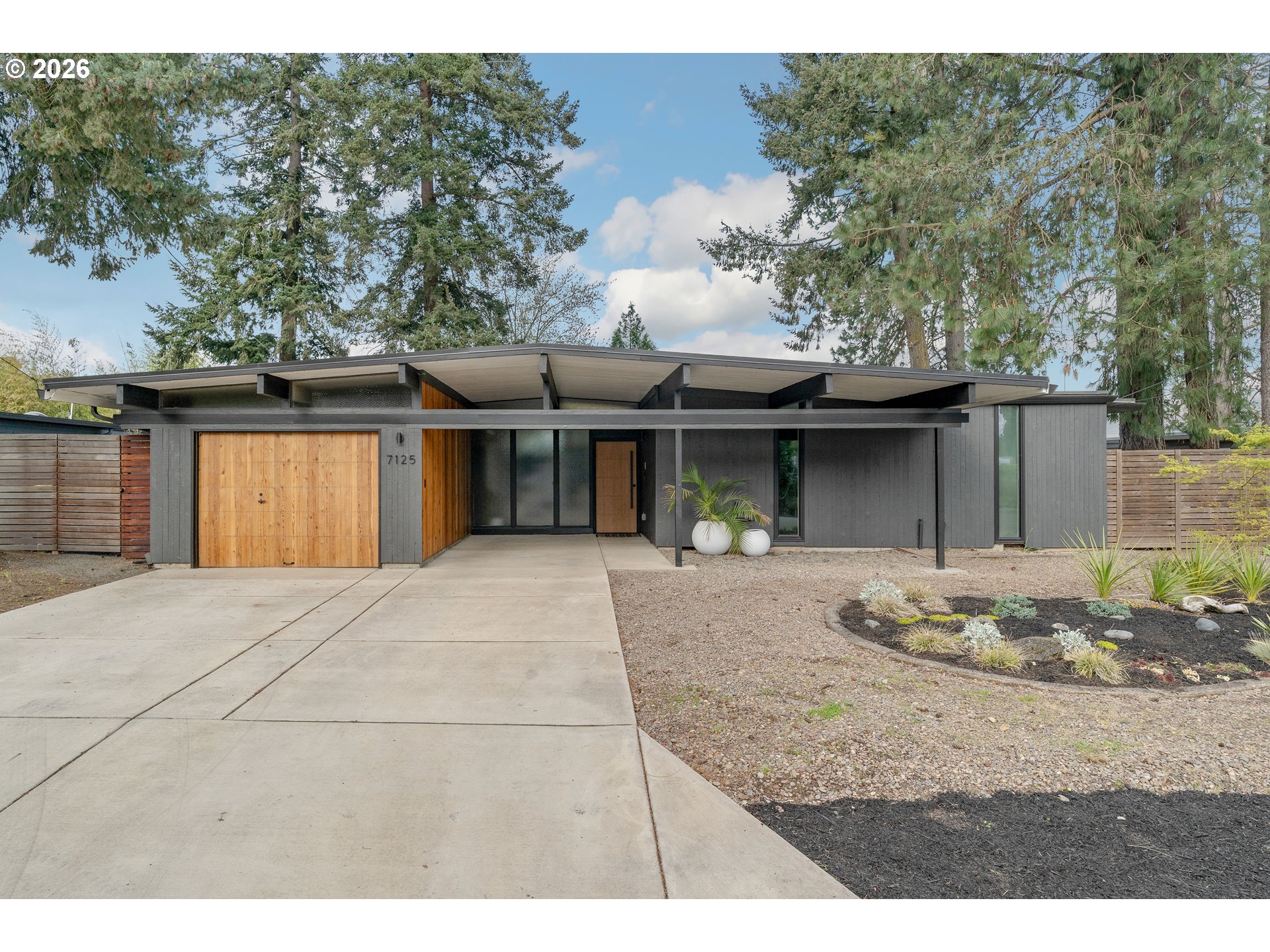 7125 Southwest 105th Avenue Beaverton, OR 97008 - Photo 1 of 39 a front view of a house with entertaining space