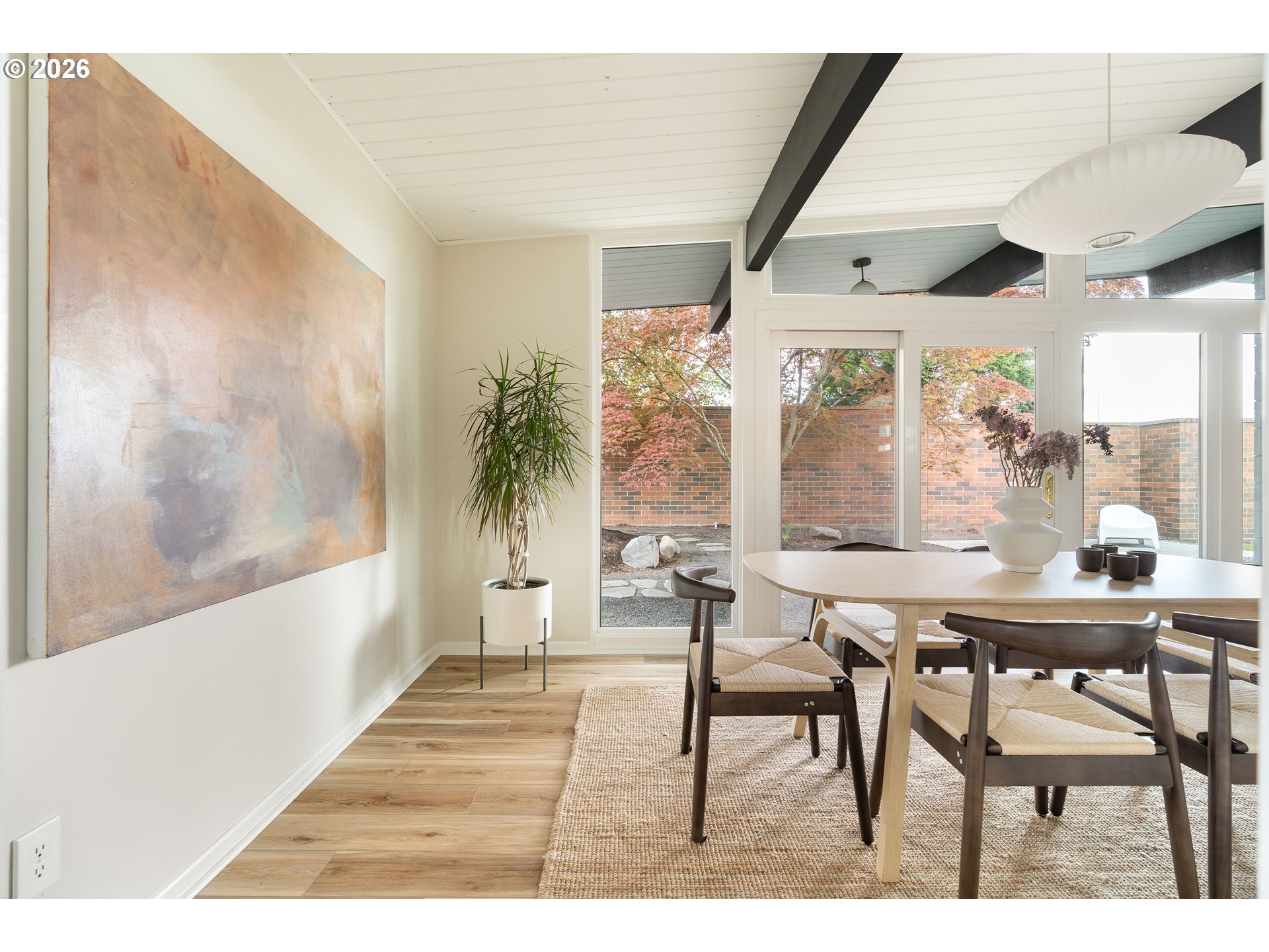 7125 Southwest 105th Avenue Beaverton, OR 97008 - Photo 20 of 39 a dining room with a wooden table and chairs
