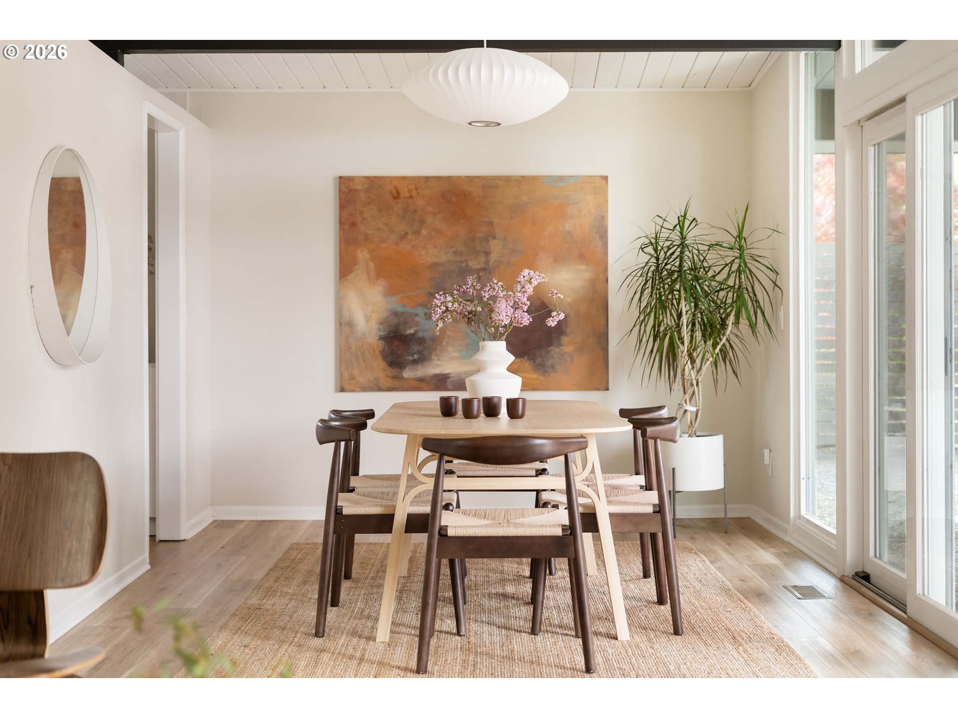 7125 Southwest 105th Avenue Beaverton, OR 97008 - Photo 22 of 39 a view of a dining room with furniture and wooden floor