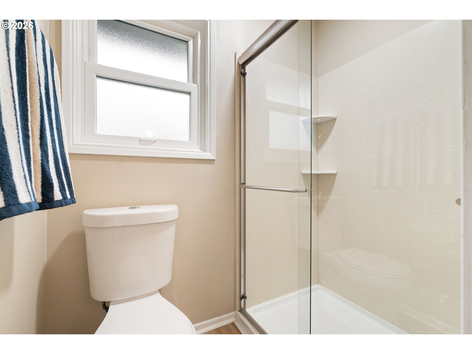 7125 Southwest 105th Avenue Beaverton, OR 97008 - Photo 27 of 39 a bathroom with a toilet and a shower