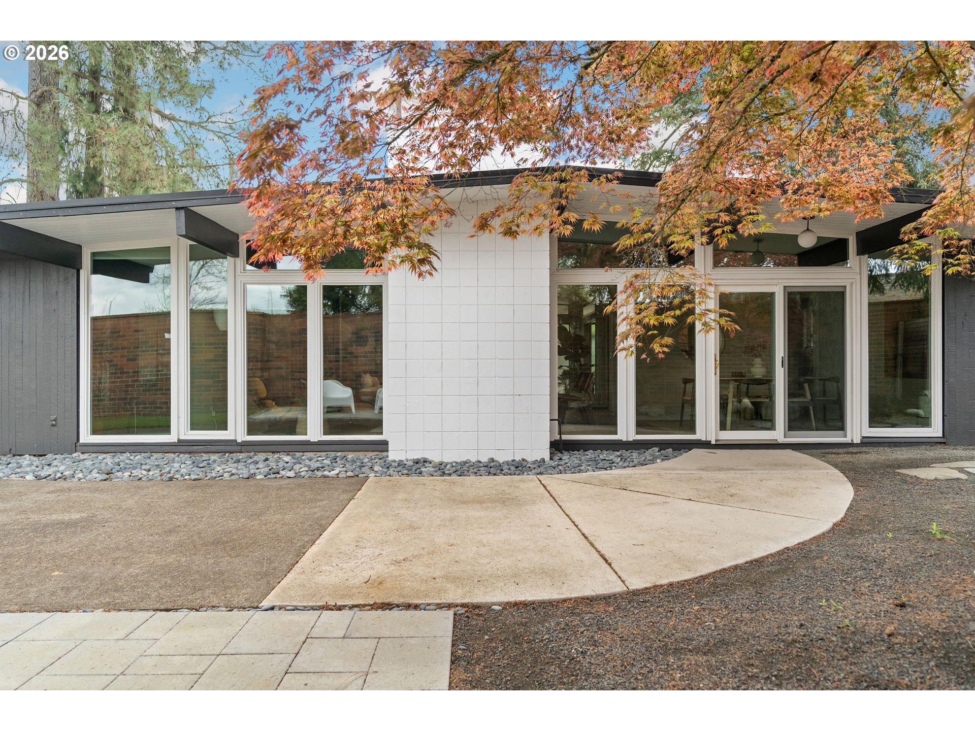 7125 Southwest 105th Avenue Beaverton, OR 97008 - Photo 39 of 39 a view of a white house with a outdoor space