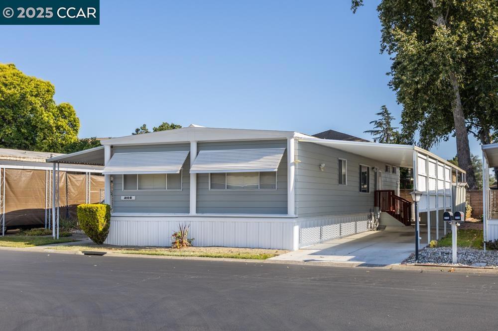 2110 Dalis Drive Concord, CA 94520 - Photo 2 of 30 a front view of a house with a yard and garage