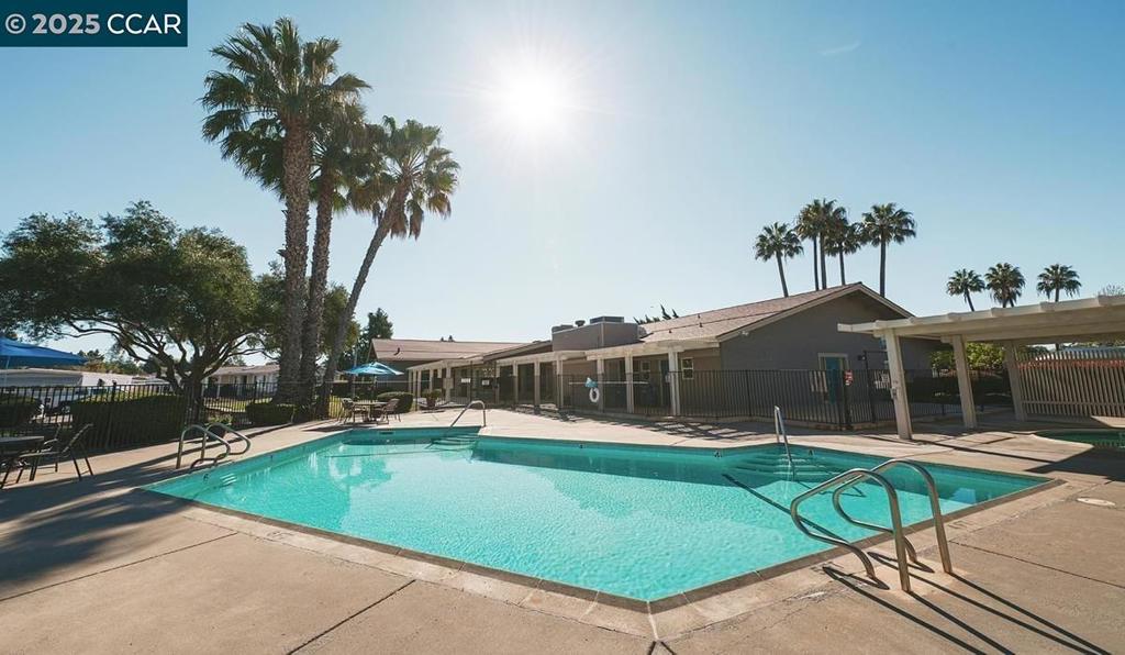 2110 Dalis Drive Concord, CA 94520 - Photo 25 of 30 a view of a swimming pool with a patio and a yard