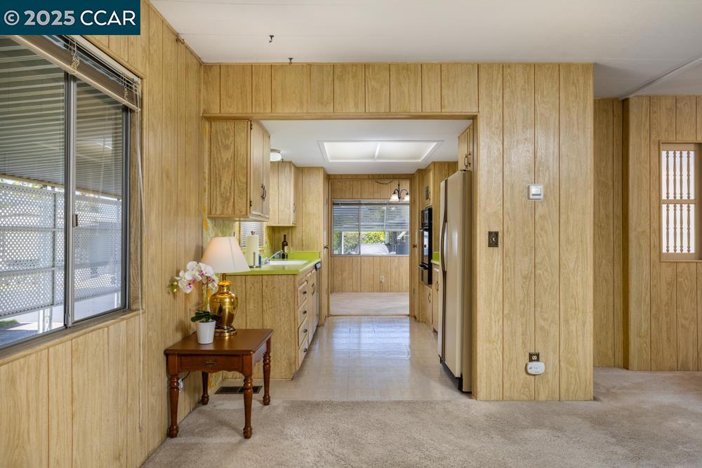 2110 Dalis Drive Concord, CA 94520 - Photo 9 of 30 a view of a hallway with wooden floor windows and a bathroom