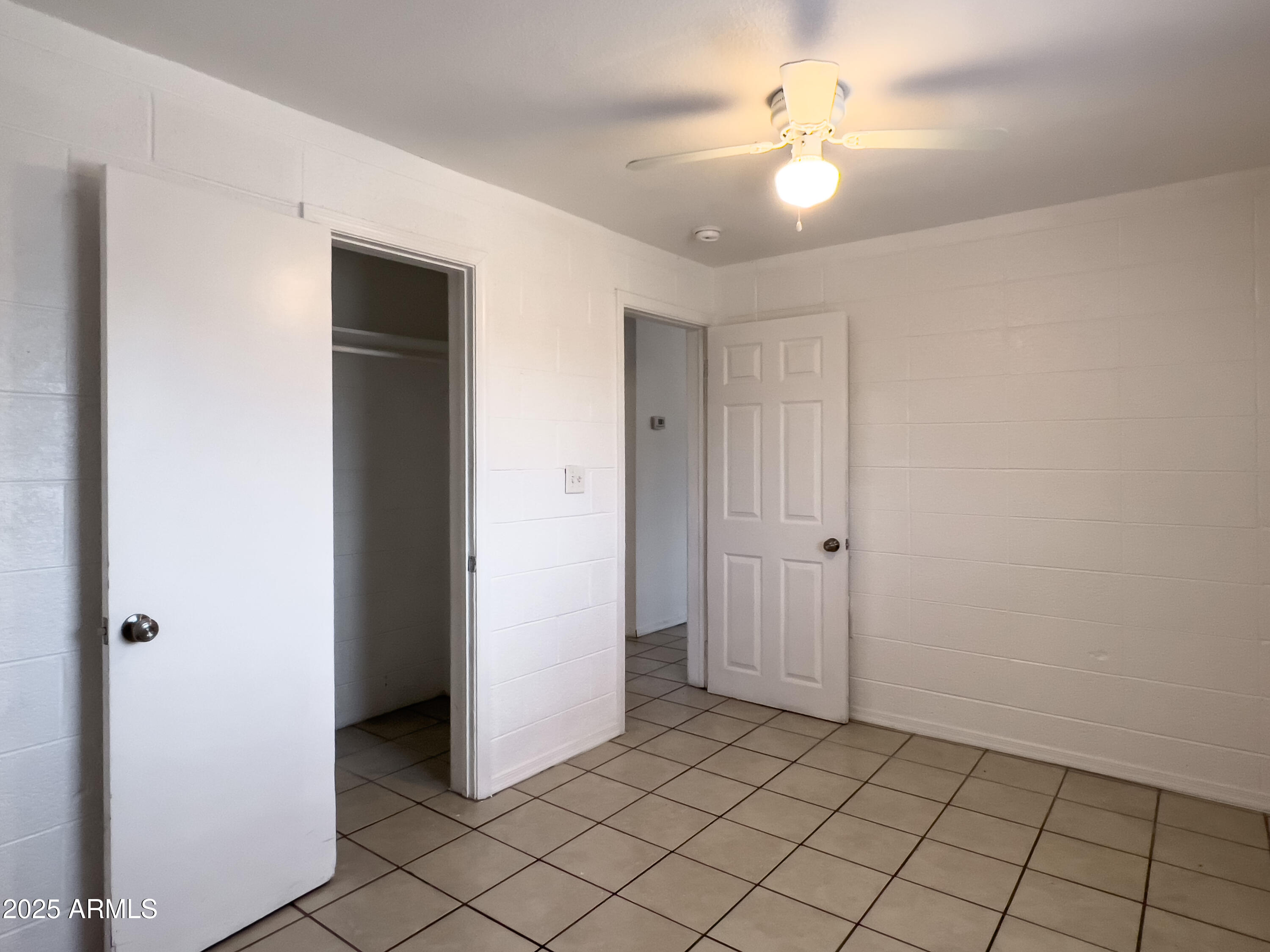 1520 West Sahuaro Drive, Unit B Phoenix, AZ 85029 - Photo 15 of 25 a view of an empty room and chandelier fan