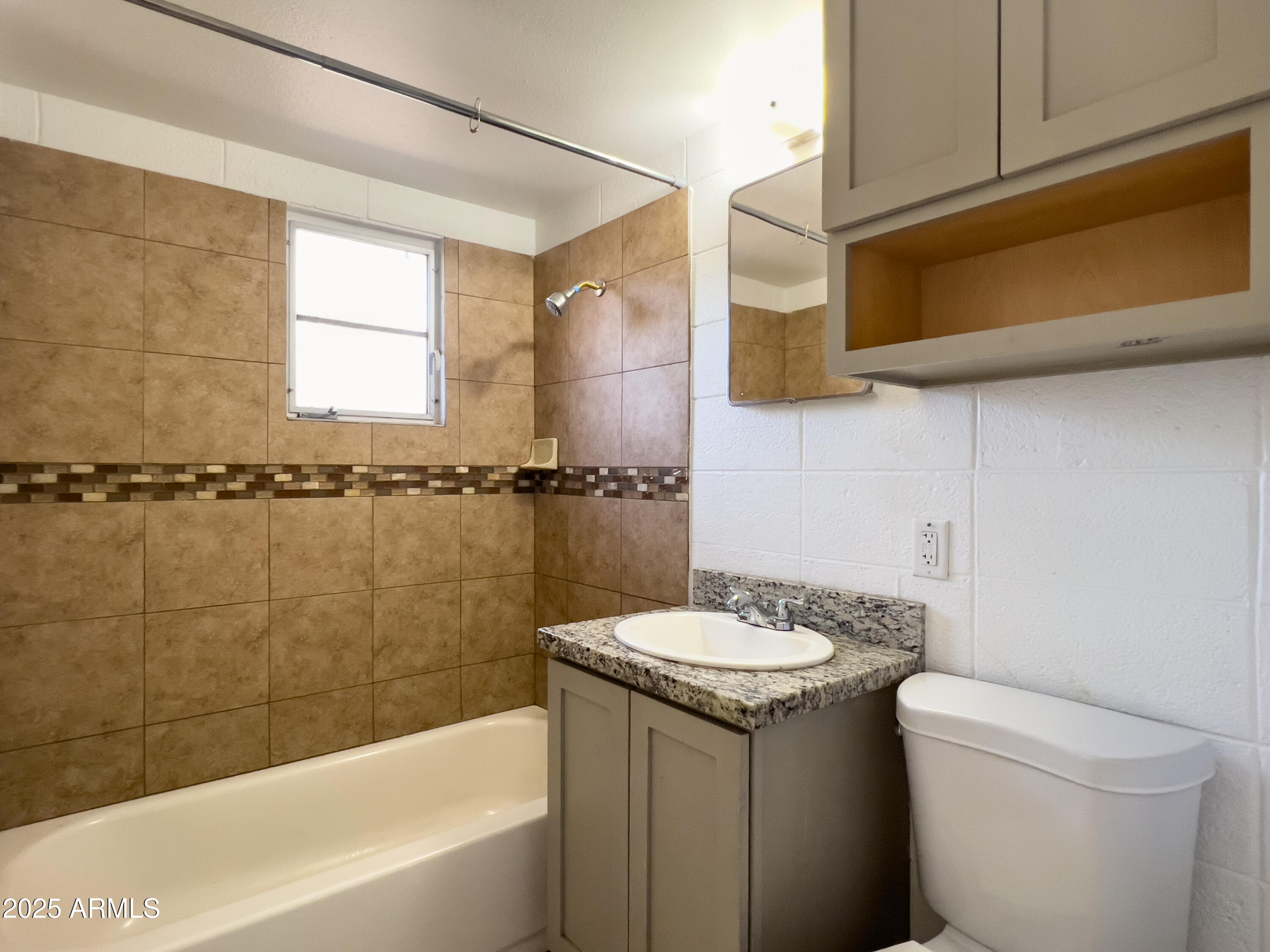 1520 West Sahuaro Drive, Unit B Phoenix, AZ 85029 - Photo 16 of 25 a bathroom with a sink a toilet and bathtub