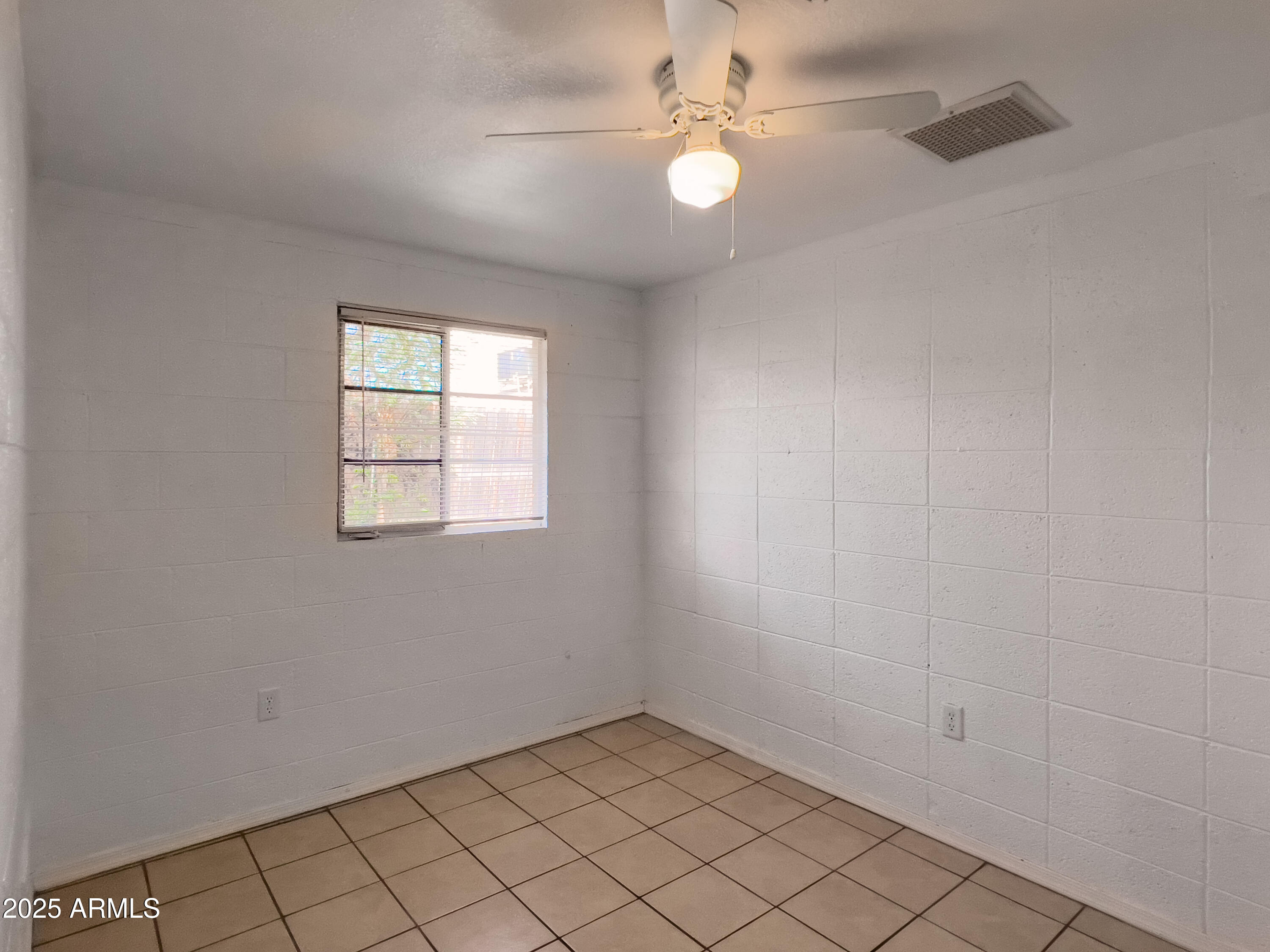 1520 West Sahuaro Drive, Unit B Phoenix, AZ 85029 - Photo 17 of 25 an empty room with windows