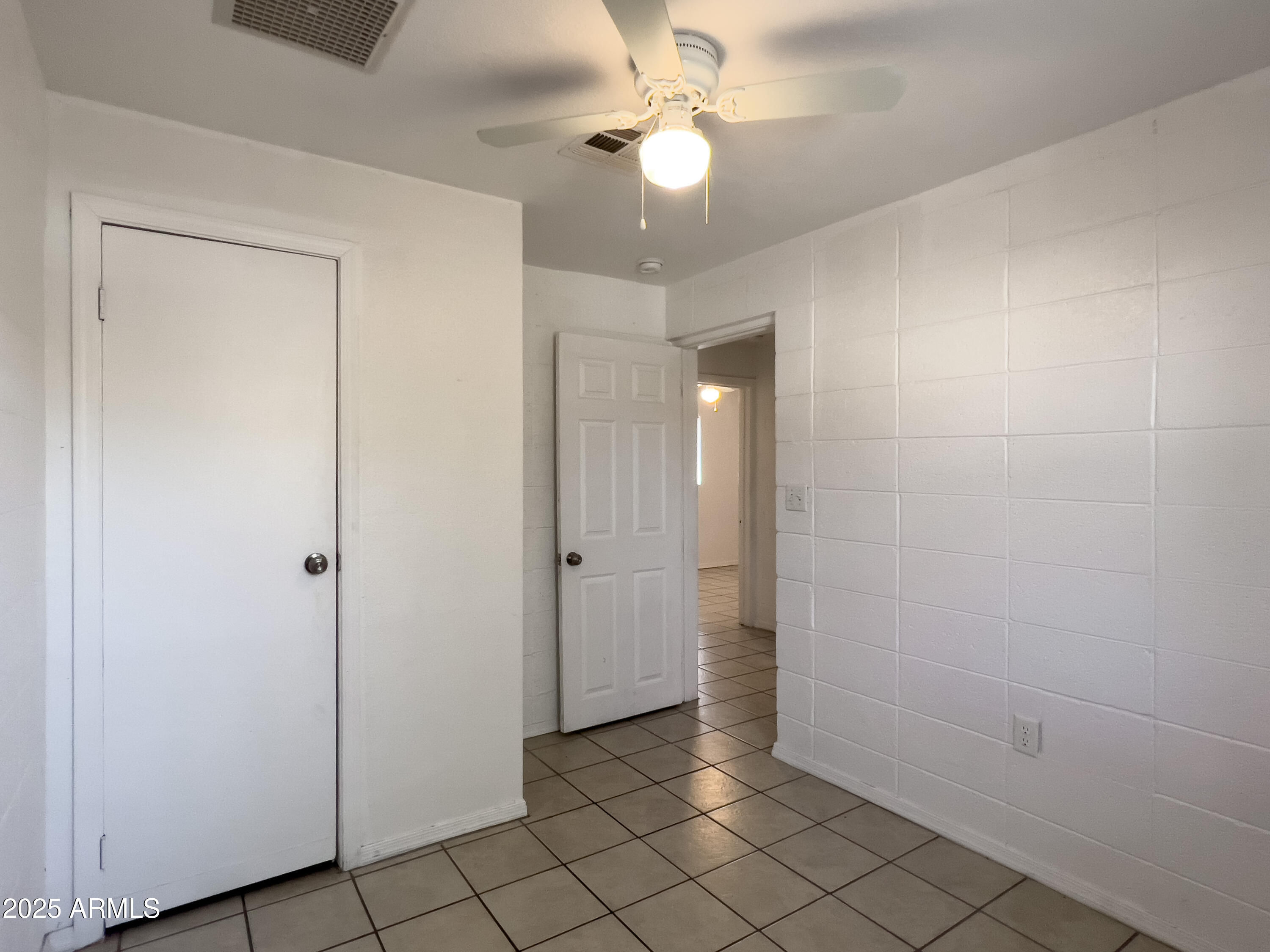 1520 West Sahuaro Drive, Unit B Phoenix, AZ 85029 - Photo 18 of 25 wooden floor in an empty room