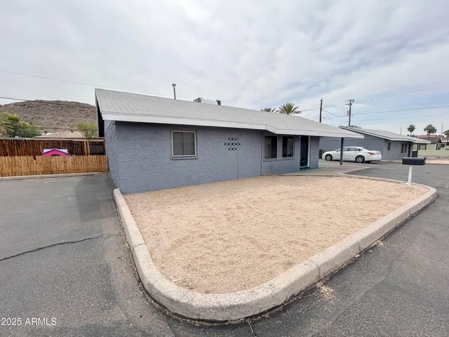 a front view of a house with garage