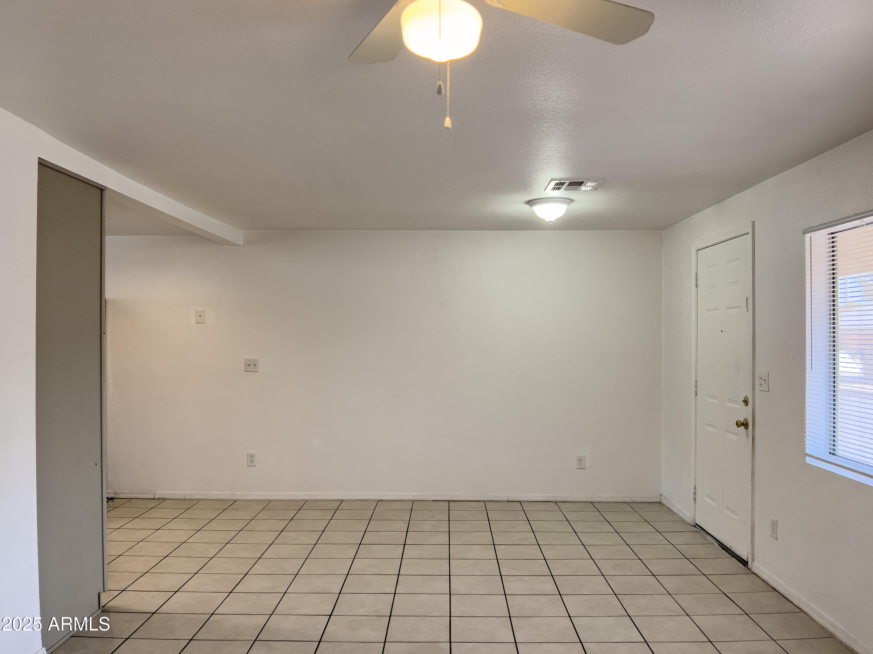 1520 West Sahuaro Drive, Unit B Phoenix, AZ 85029 - Photo 6 of 25 a view of an empty room with a window