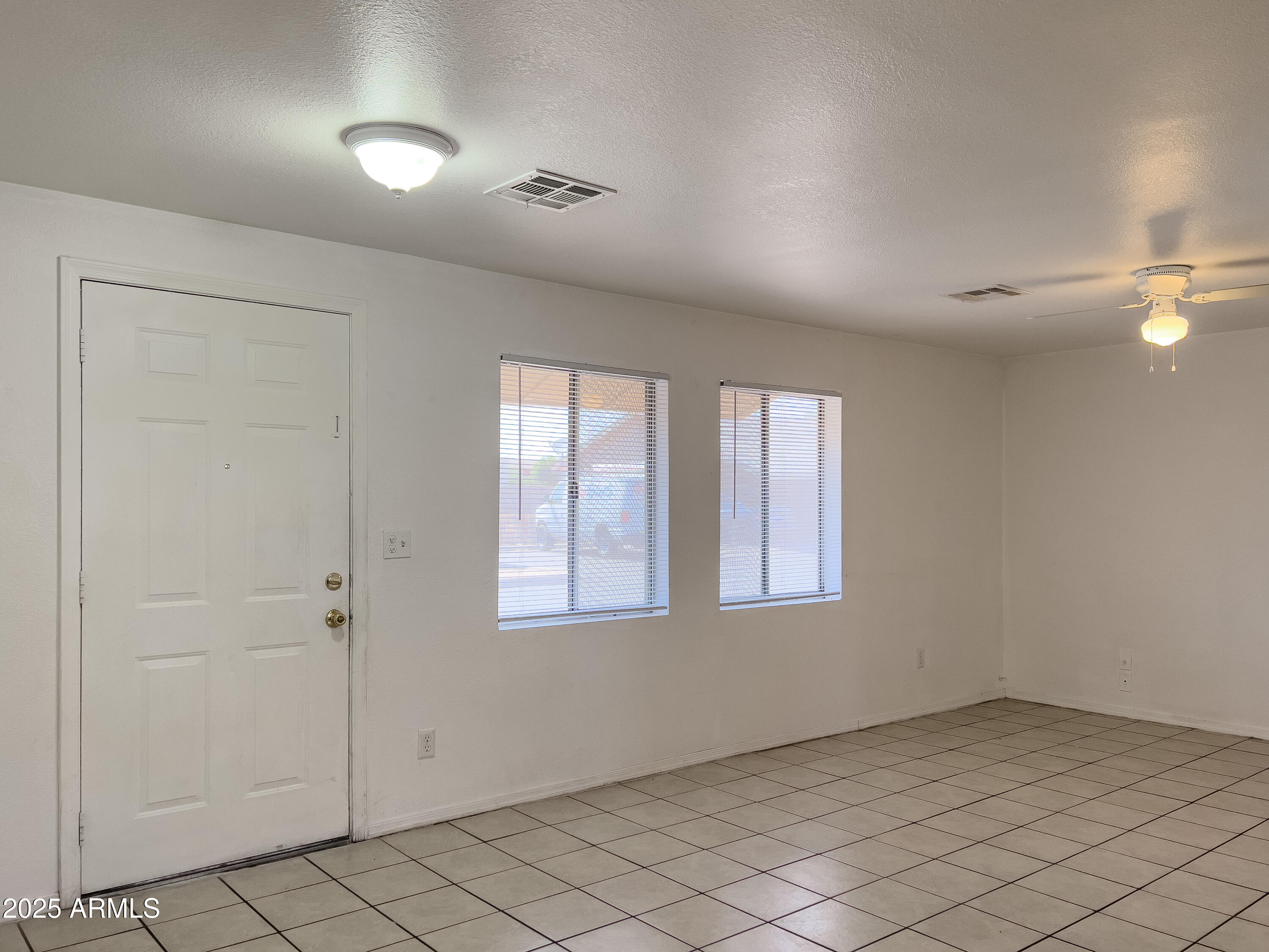 1520 West Sahuaro Drive, Unit B Phoenix, AZ 85029 - Photo 9 of 25 an empty room with windows