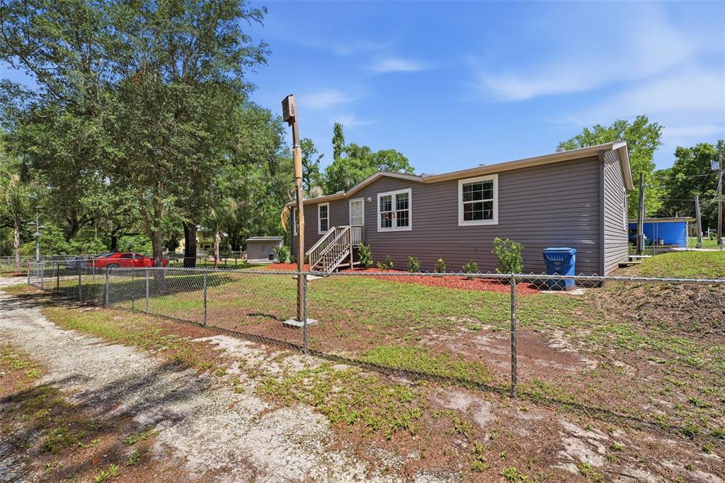 3183 Cedley Road Dade City, FL 33523 - Photo 41 of 48 a view of a house with backyard