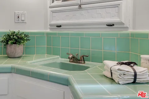 a bathroom with a sink and a window