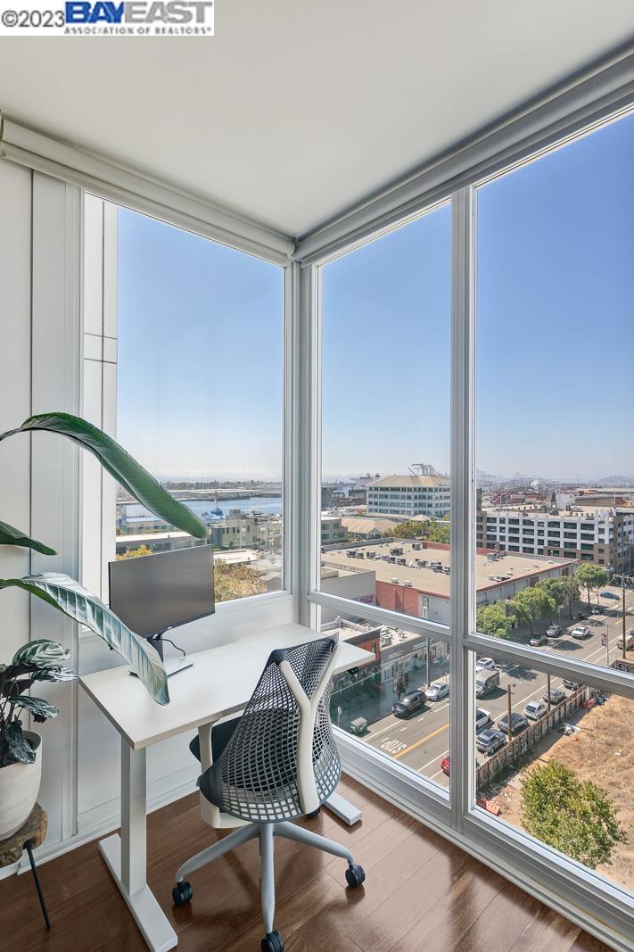 222 Broadway, Unit 1004 Oakland, CA 94607 - Photo 21 of 60 a living room with a floor to ceiling window and pool table