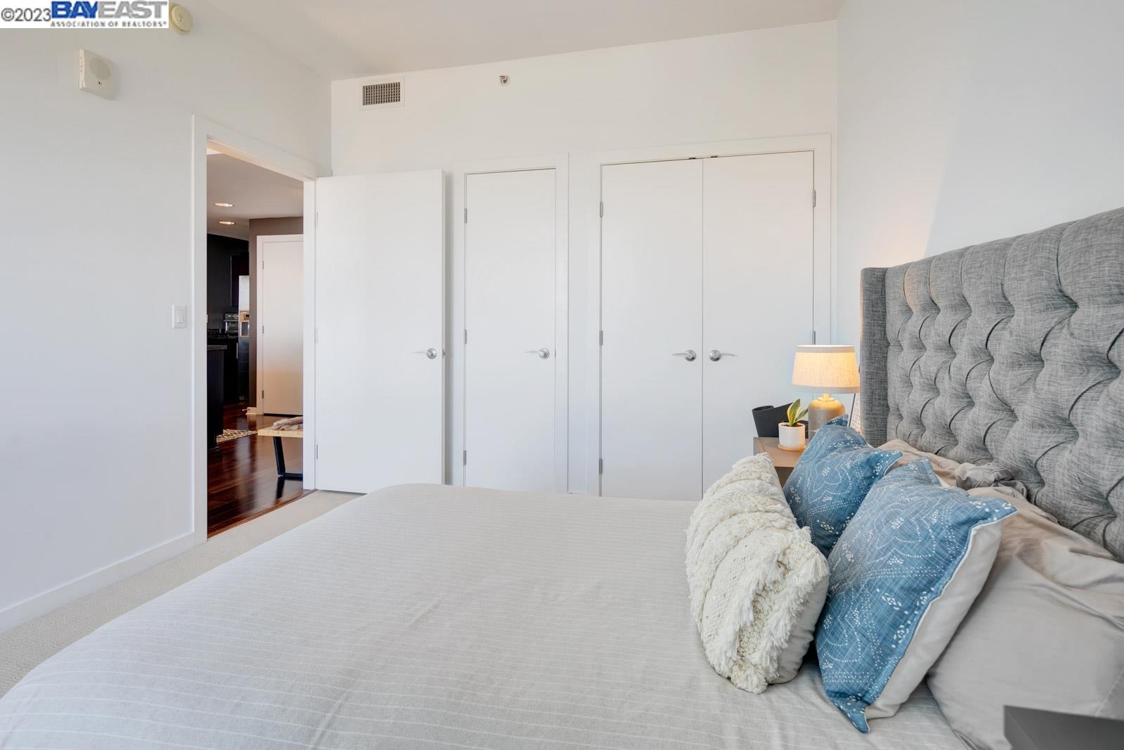 222 Broadway, Unit 1004 Oakland, CA 94607 - Photo 23 of 60 a living room with furniture and a couch