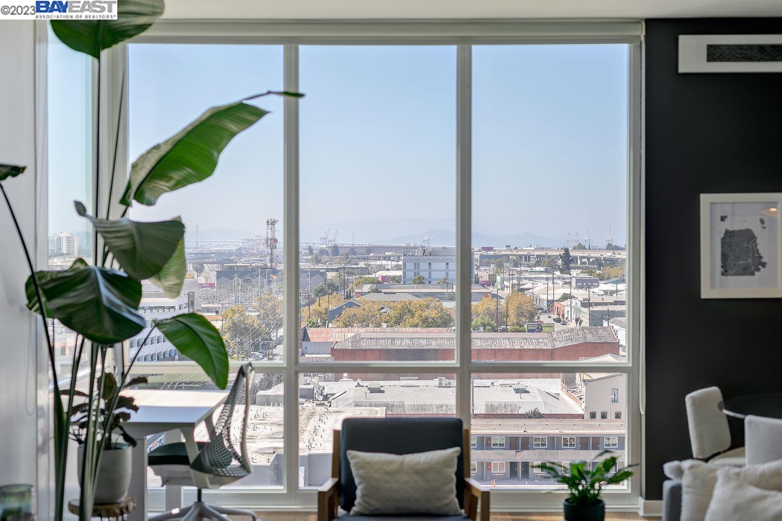 222 Broadway, Unit 1004 Oakland, CA 94607 - Photo 34 of 60 a living room with furniture and a potted plant