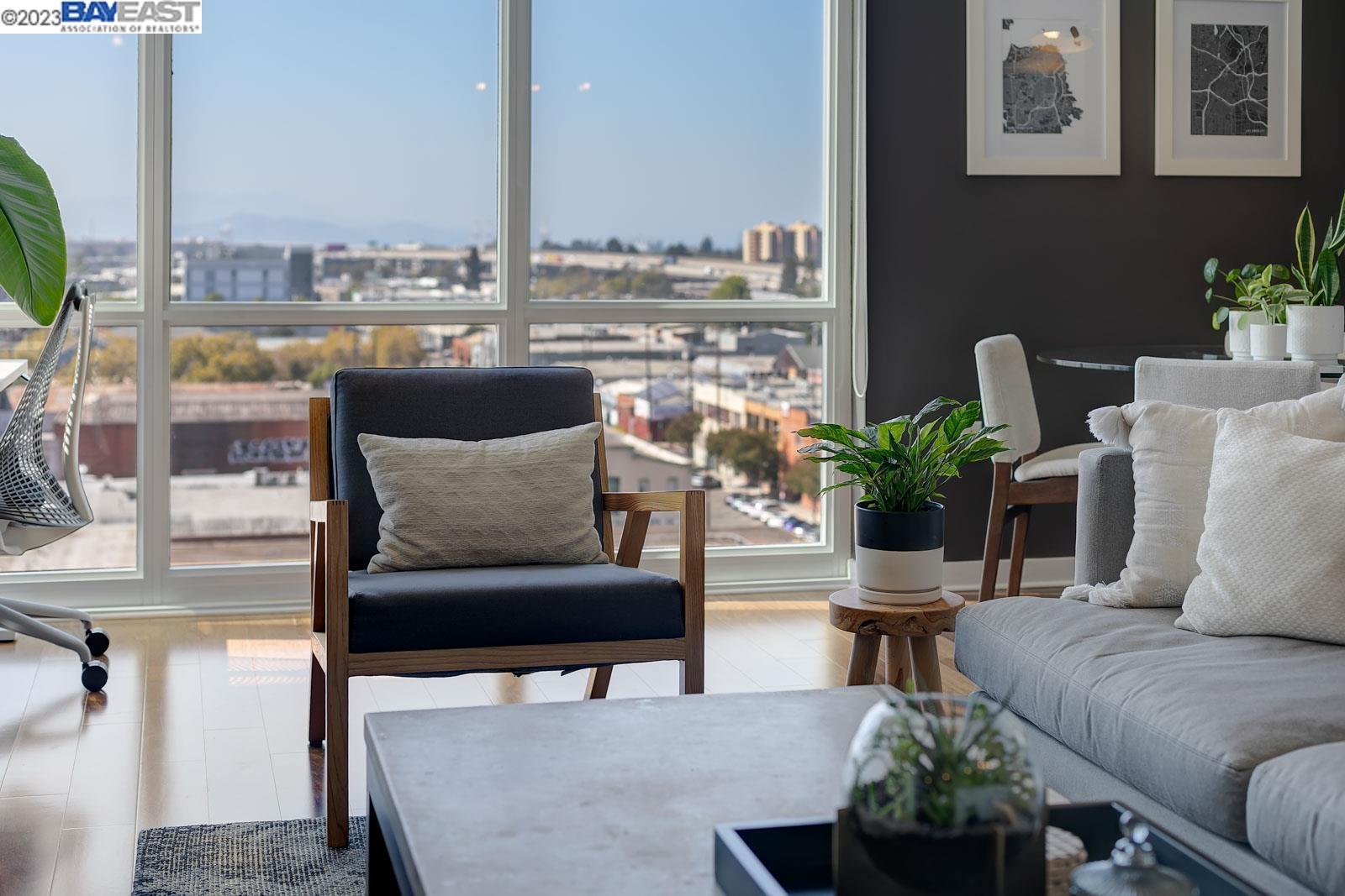 222 Broadway, Unit 1004 Oakland, CA 94607 - Photo 35 of 60 a living room with furniture and a potted plant