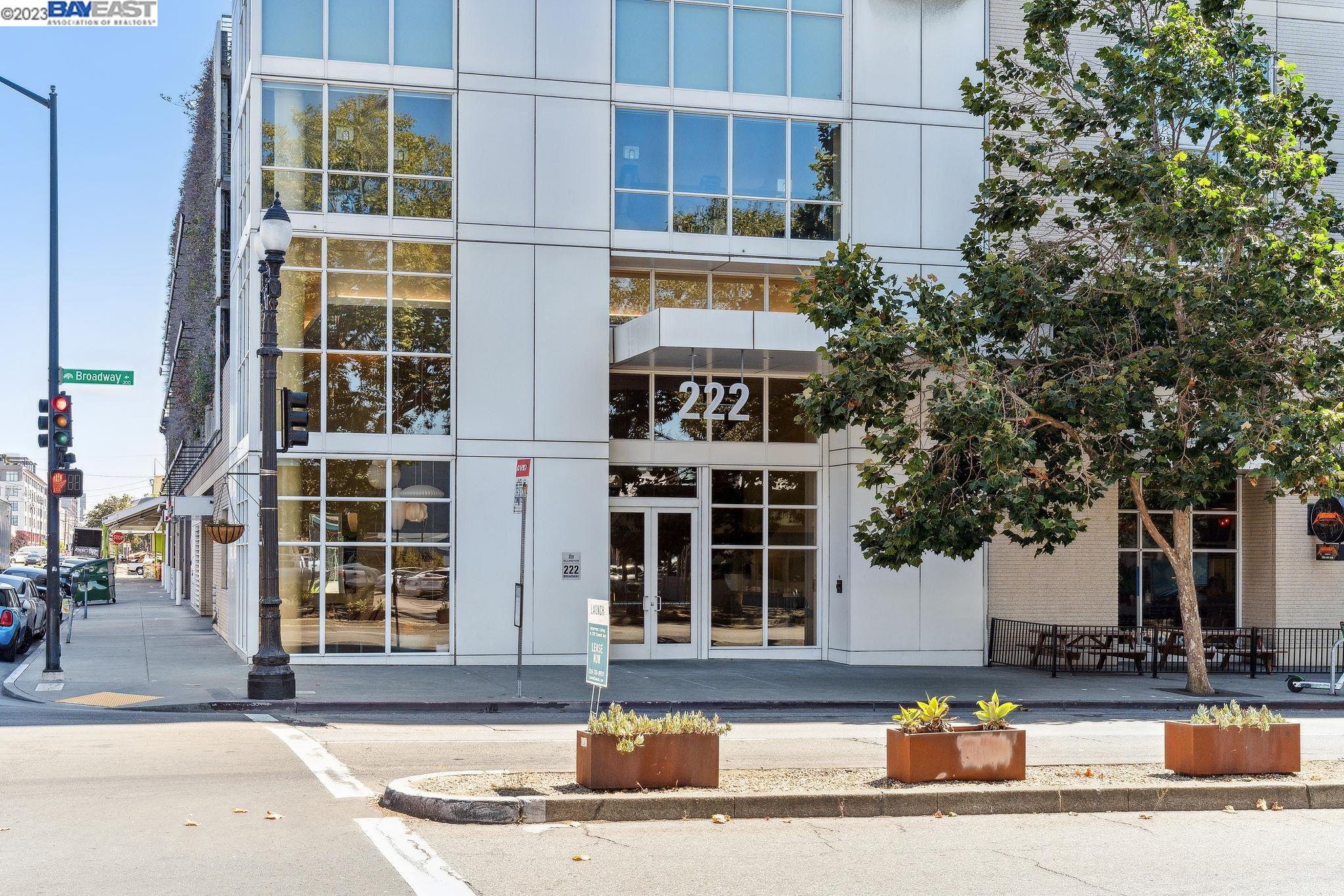 222 Broadway, Unit 1004 Oakland, CA 94607 - Photo 58 of 60 a front view of a building with a street