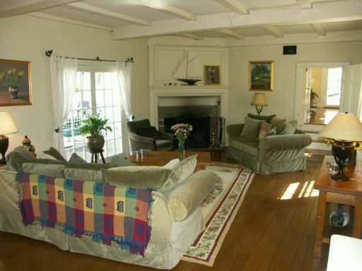 Undisclosed Address Cos Cob, CT 06807 - Photo 5 of 8 a living room with fireplace furniture and a fireplace