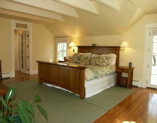 Undisclosed Address Cos Cob, CT 06807 - Photo 6 of 8 a bed room with a bed and a night stand