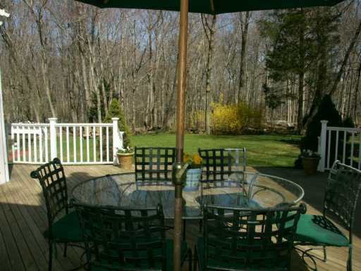 Undisclosed Address Cos Cob, CT 06807 - Photo 8 of 8 a view of a chairs and table in the patio