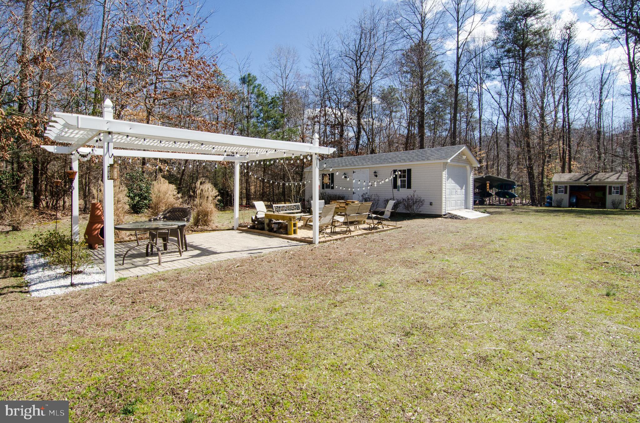 6778 St Pauls Road King George, VA 22485 - Photo 5 of 74 Pergola and fire pit area