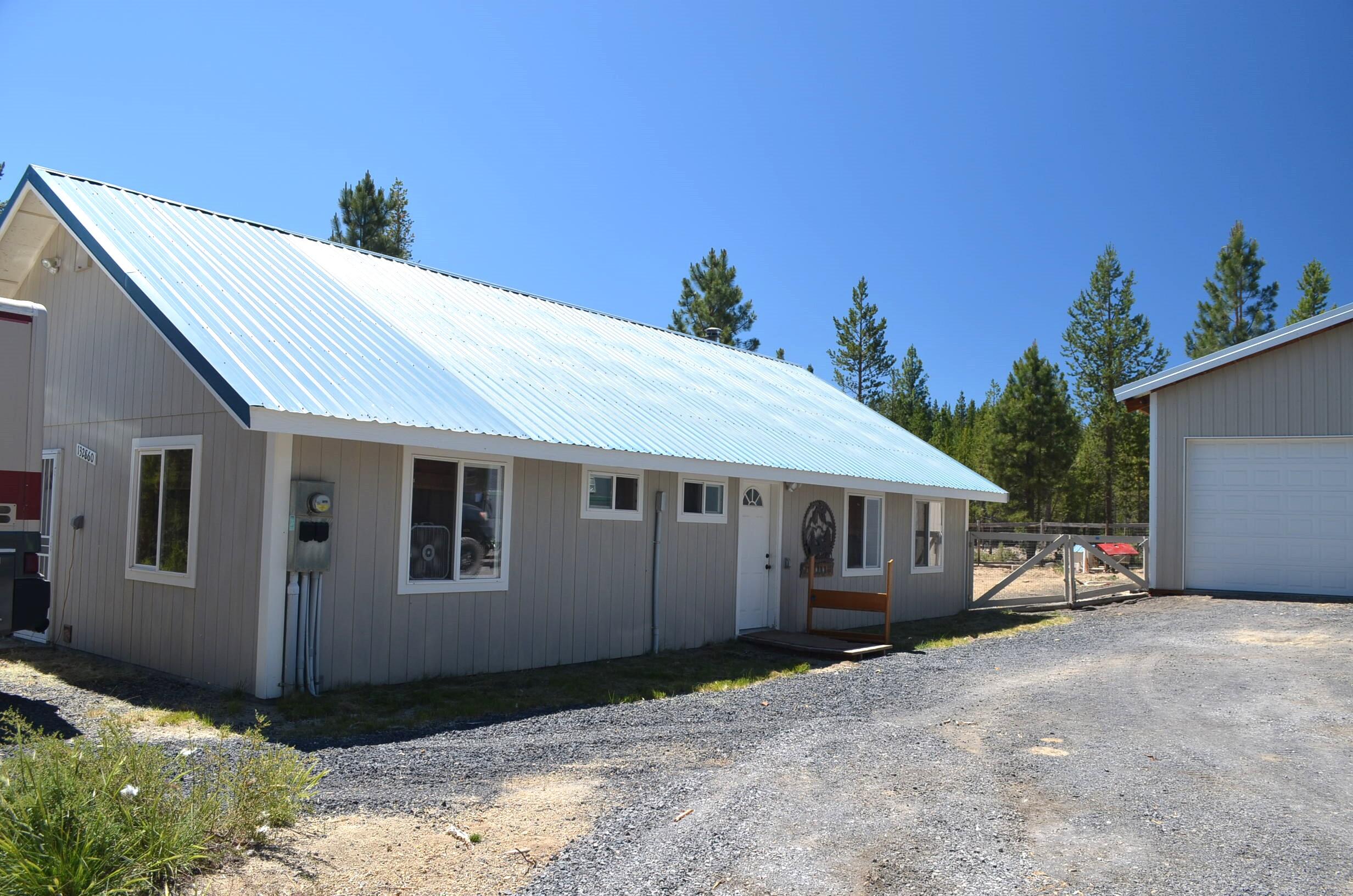 132860 Highway 97 Crescent, OR 97733 - Photo 14 of 25 a view of a house with a backyard