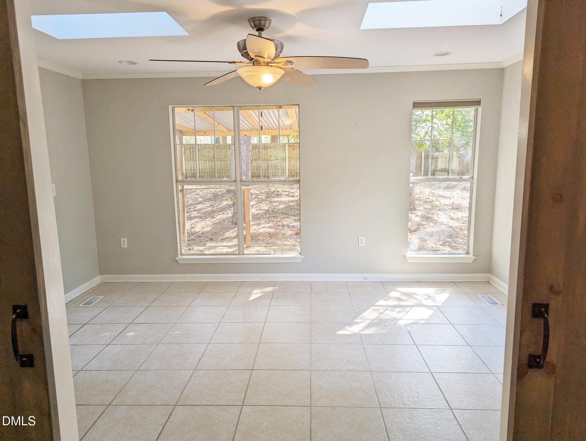 7416 Ray Road Raleigh, NC 27613 - Photo 3 of 12 a view of an empty room with a window