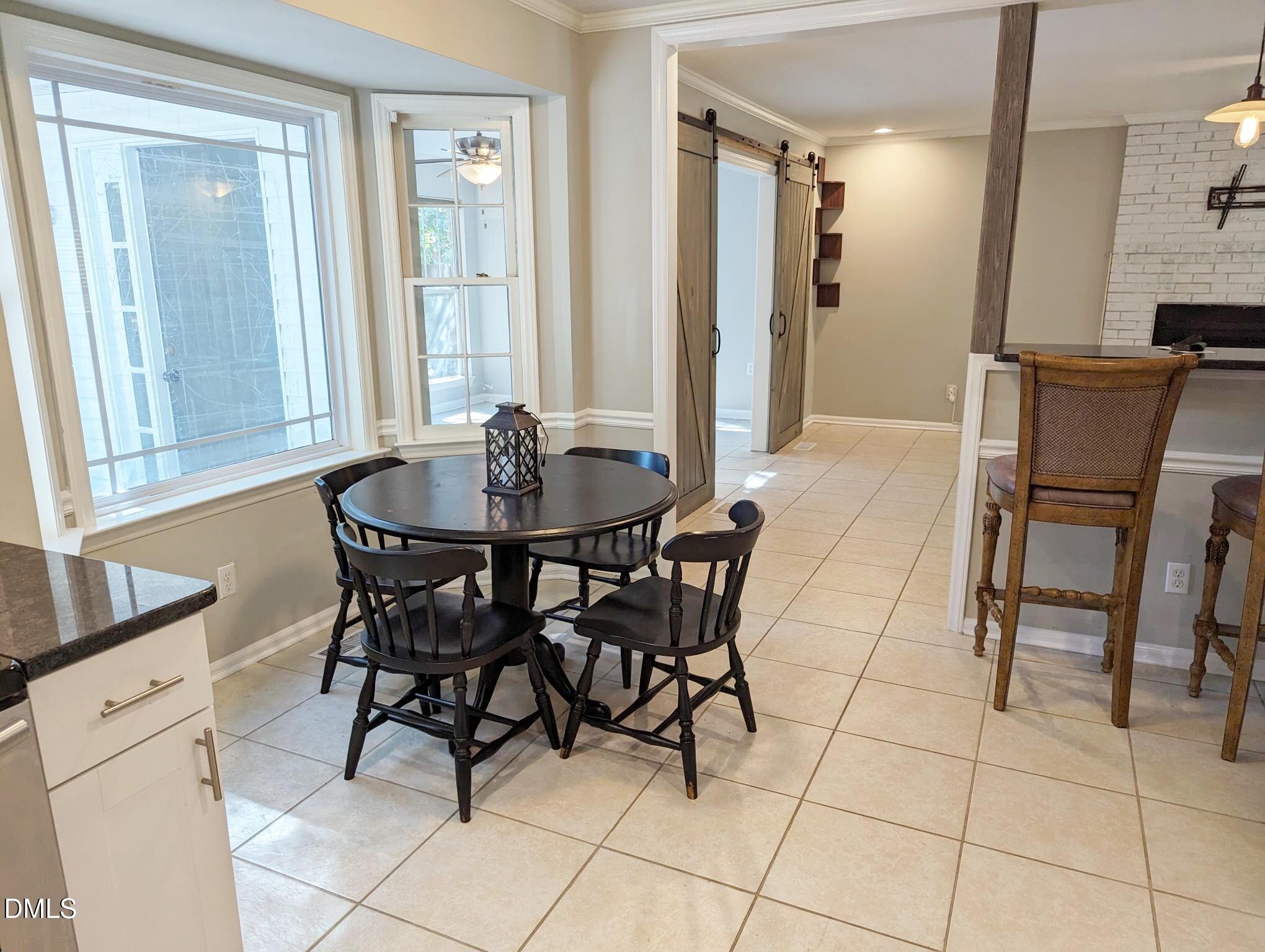 7416 Ray Road Raleigh, NC 27613 - Photo 6 of 12 a dining room well furnished