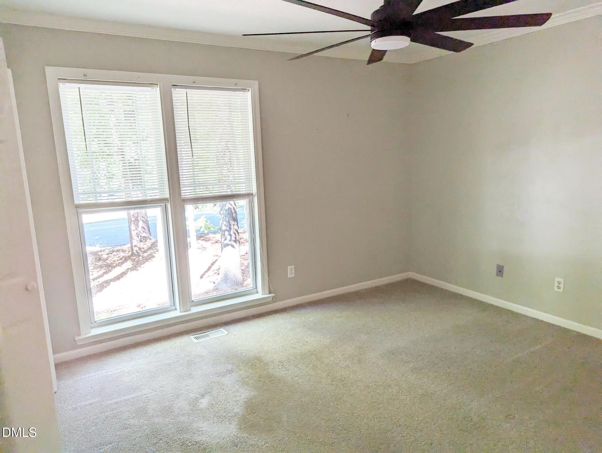 7416 Ray Road Raleigh, NC 27613 - Photo 9 of 12 an empty room with a window