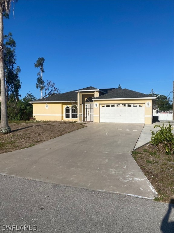 18620 Sebring Road Fort Myers, FL 33967 - Photo 1 of 32 a view of a big yard with a tree