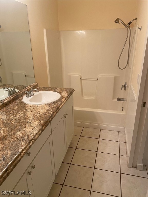 18620 Sebring Road Fort Myers, FL 33967 - Photo 20 of 32 a bathroom with a granite countertop sink a toilet and a mirror