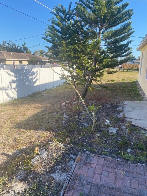 18620 Sebring Road Fort Myers, FL 33967 - Photo 29 of 32 a view of a yard with wooden fence