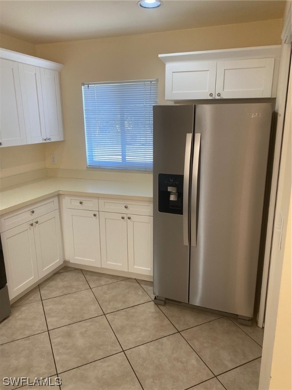 18620 Sebring Road Fort Myers, FL 33967 - Photo 7 of 32 a kitchen with a refrigerator sink and cabinets