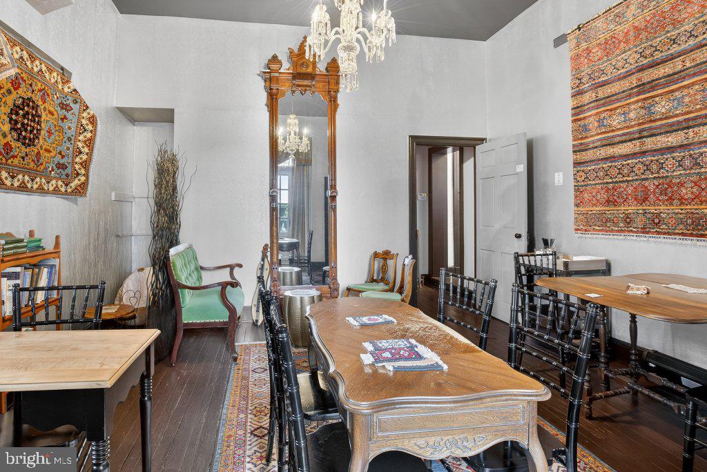 22 South 2nd Street Columbia, PA 17512 - Photo 15 of 40 a dining room with furniture a chandelier and wooden floor