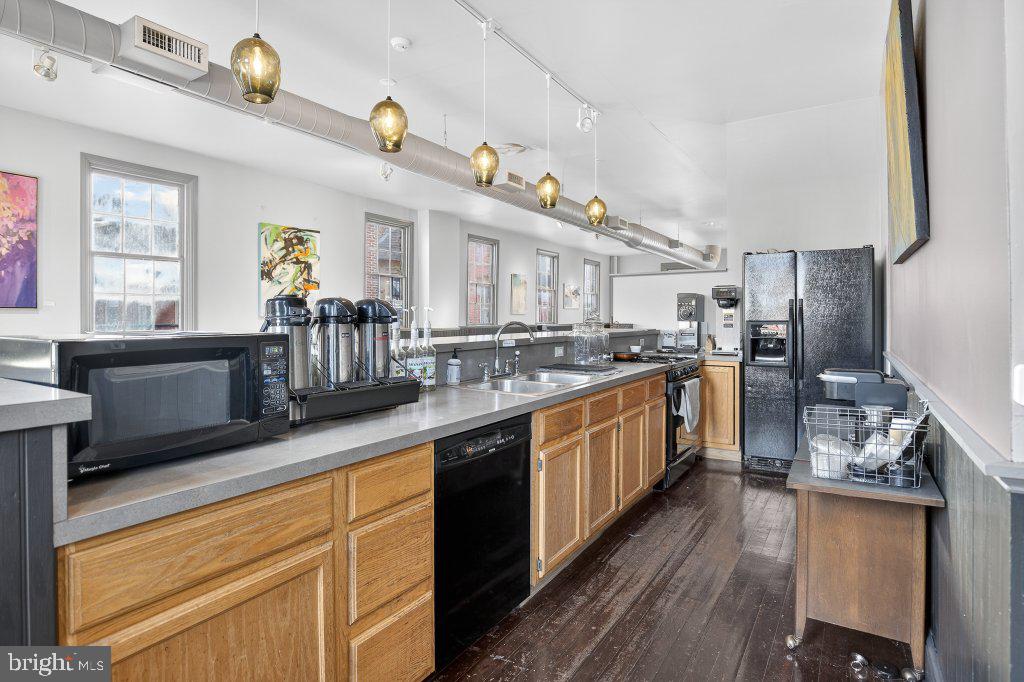 22 South 2nd Street Columbia, PA 17512 - Photo 25 of 40 a kitchen with stainless steel appliances granite countertop a sink and cabinets