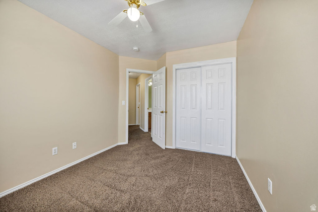 2 West 1780 North Logan, UT 84341 - Photo 20 of 24 Unfurnished bedroom featuring carpet, a closet, and a ceiling fan