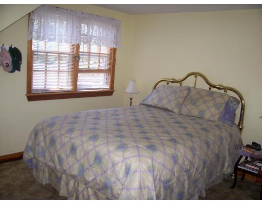 7 Washington Terrace Woburn, MA 01801 - Photo 13 of 16 a bedroom with a bed and a window