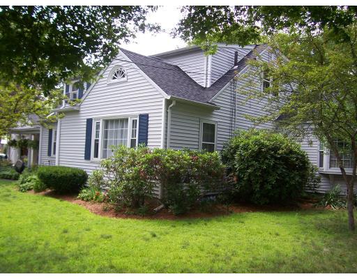 7 Washington Terrace Woburn, MA 01801 - Photo 2 of 16 a front view of a house with a garden