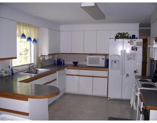 7 Washington Terrace Woburn, MA 01801 - Photo 6 of 16 a kitchen with refrigerator and window